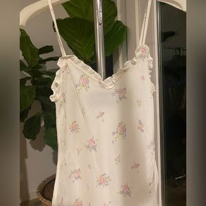 Reformation Camisole Cream with flowers.
